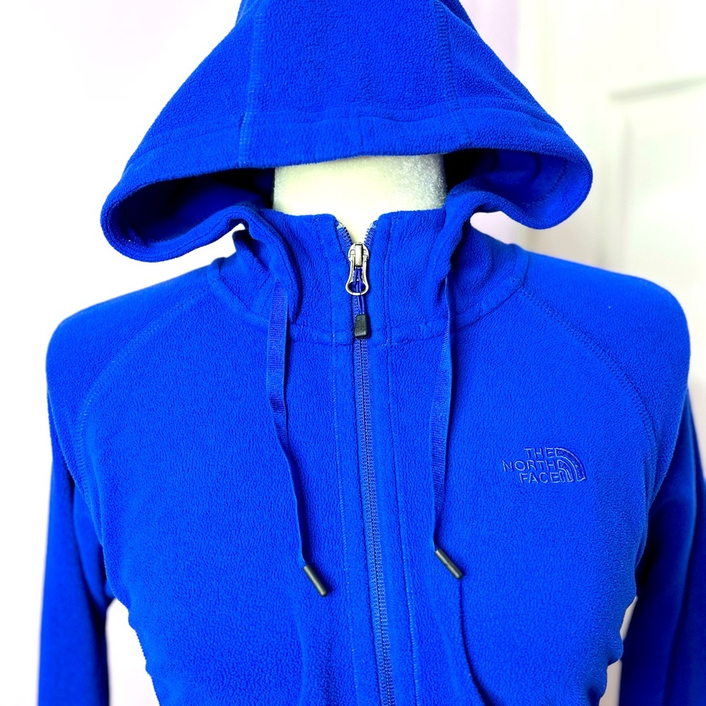 The North Face blue fleece full zip-up. Two pockets, hooves, women’s size medium